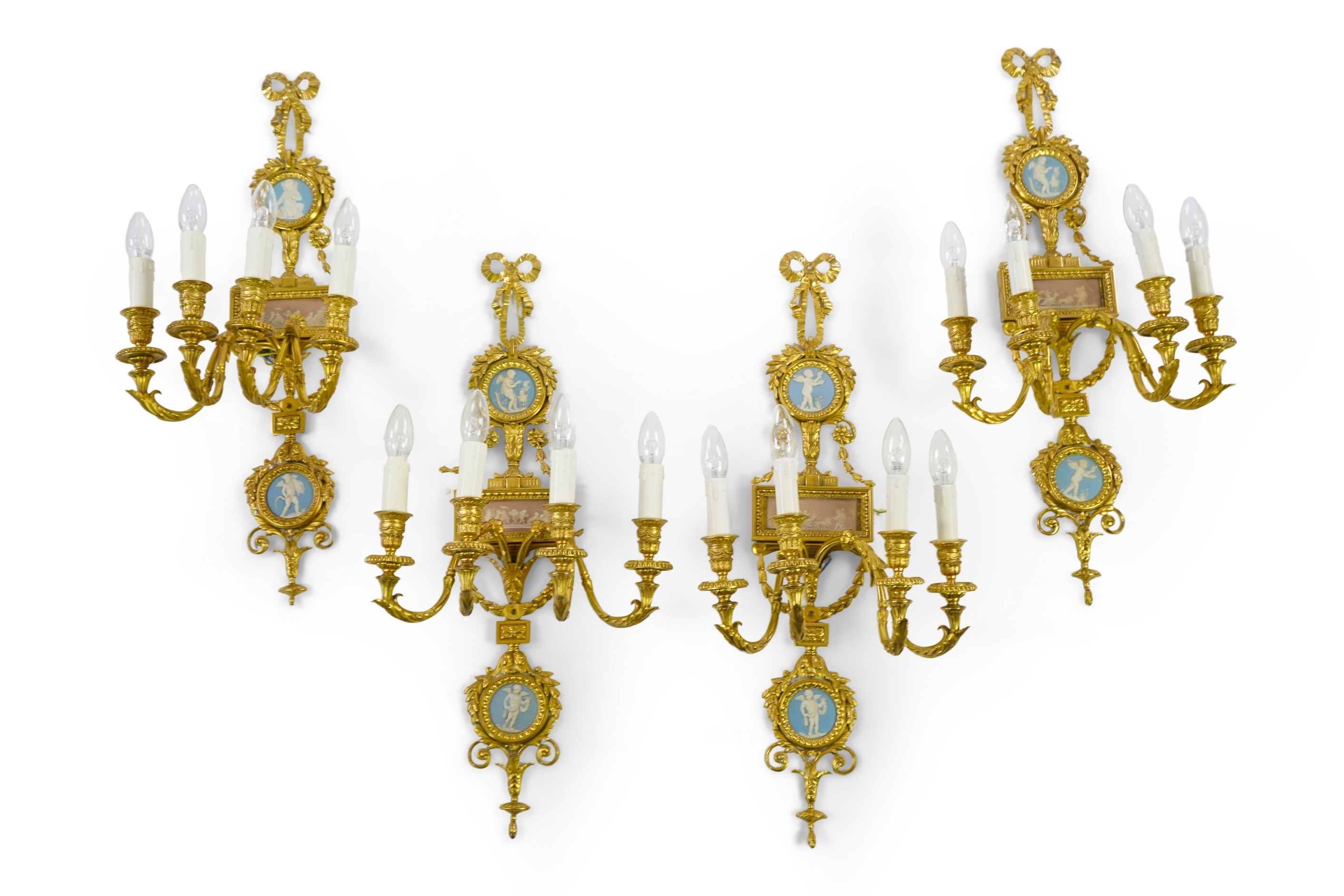 A set of four Adam style ormolu and jasper ware mounted wall appliques, early 20th century